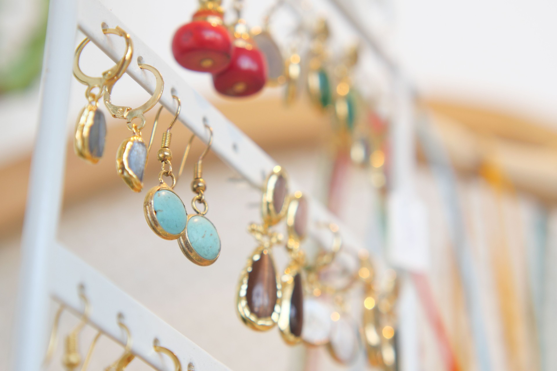 Discover a variety of colorful handmade earrings and beaded necklaces beautifully displayed